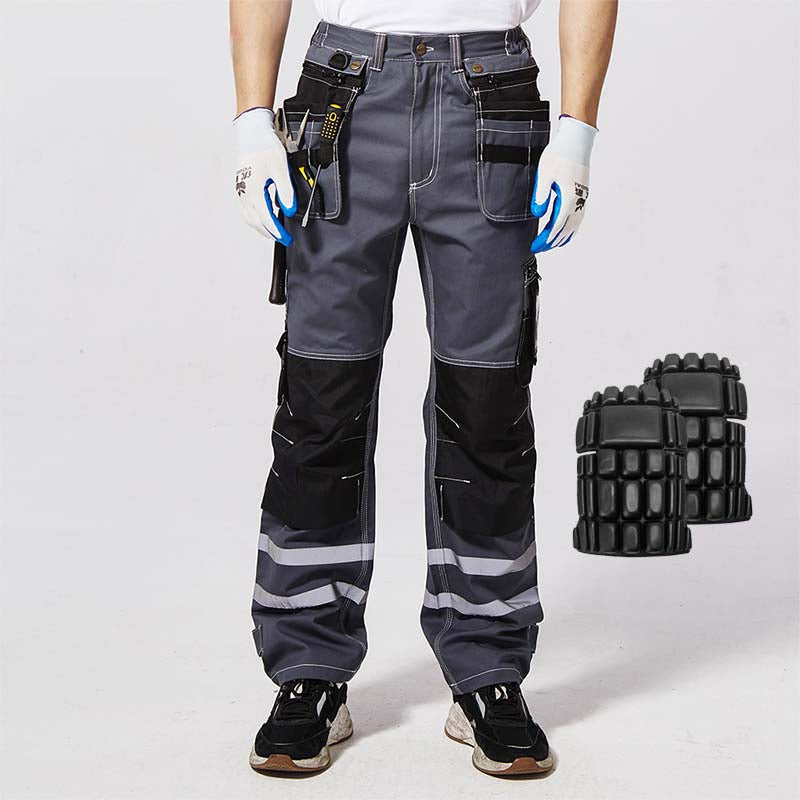 Model wearing B114 100% cotton work pants with hanging tool pockets and reflective stripes, showing removable knee pads