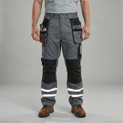 Front View of model wearing B114 100% cotton work pants with hanging tool pockets and reflective stripes, showing removable knee pads