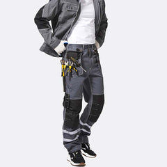 Side View of model wearing B114 100% cotton work pants with hanging tool pockets and reflective stripes, showing removable knee pads