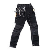 Front view of B129 Black polyester cotton work pants with knee pad pockets and multi-layered tool pockets